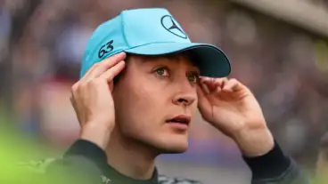 Russell survives ‘chaos’ to steal front-row start in China